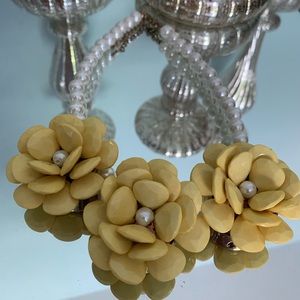 Yellow flower and pearl necklace